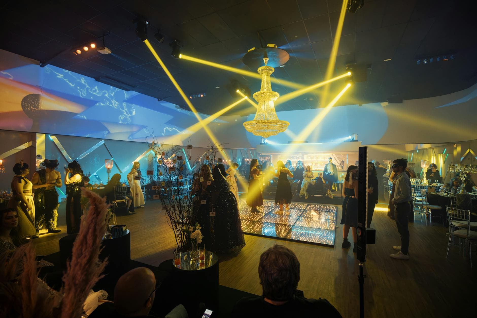 Glamorous evening party with guests on a lit dance floor