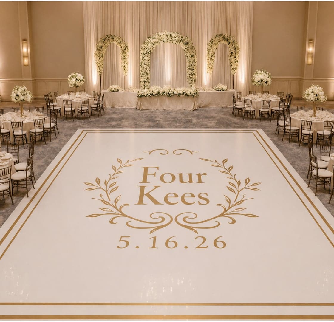 Custom Four Kees-branded white dance floor in a ballroom with floral arches