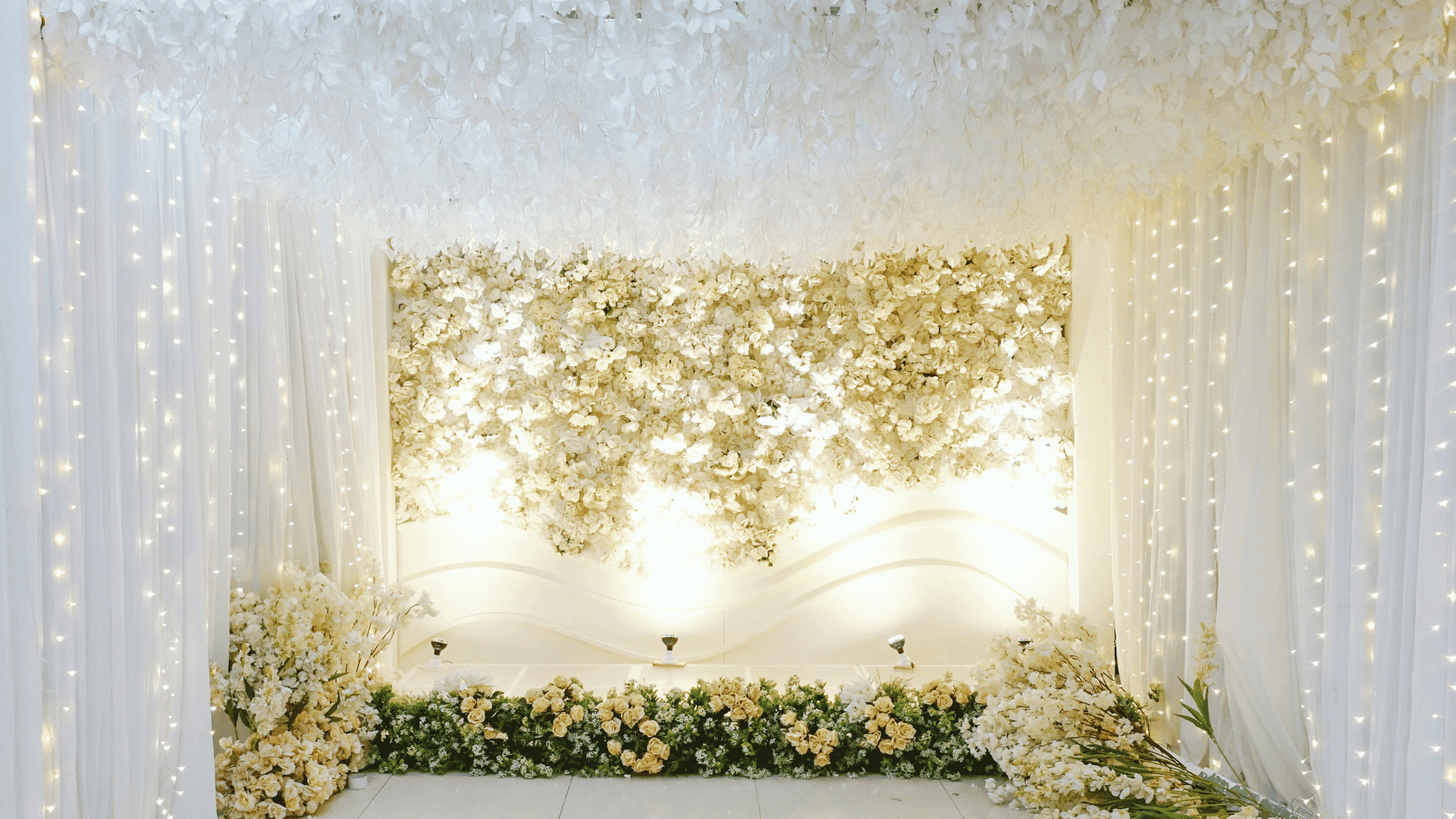 White flower wall backdrop at a Four Kees styled event